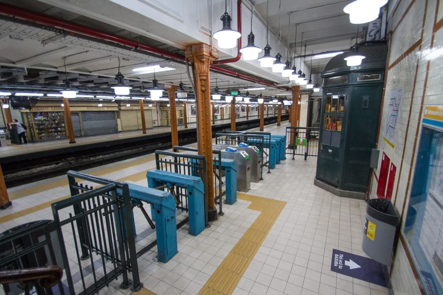 Passengers on the tiled platform of Perú station on Line A of the Buenos Aires Subte, the Southern Hemisphere's oldest metro