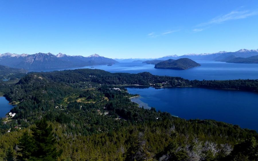View from Cerro Campanario over the blue lakes, forested peninsulas, and snowy Andean peaks near Bariloche, Patagonia