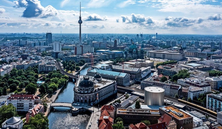 An aerial view of central Berlin with the Fernsehturm television tower, the domed Bode Museum on Museum Island and the Berlin Cathedral along the river Spree